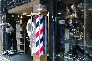 Why do all the hair salons have a barber pole in front of them?